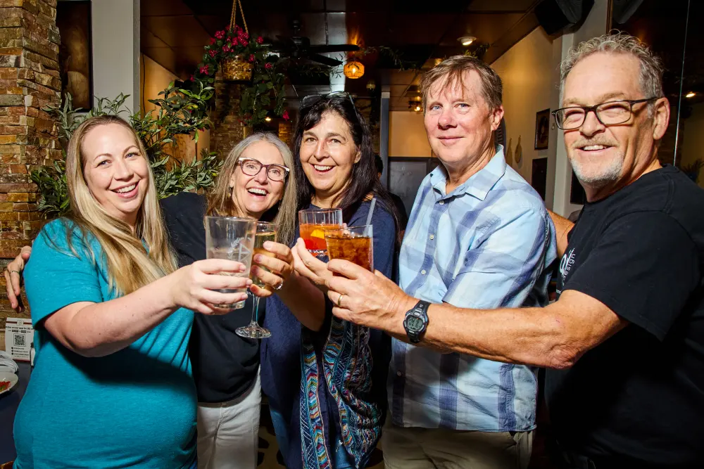 Guests sharing a toast at DPC’s kickoff gathering at Demitri’s Taverna